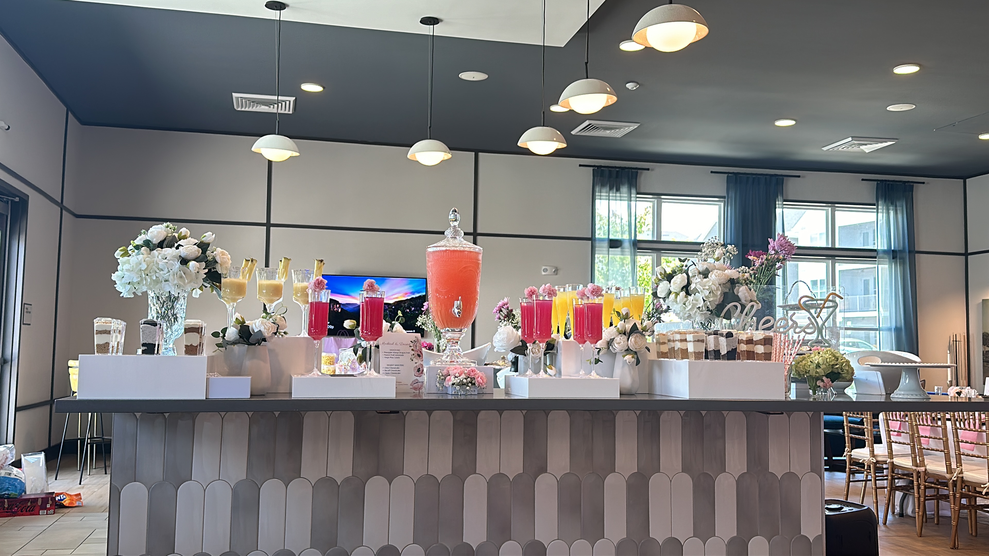 Styled dessert and drink bar with florals